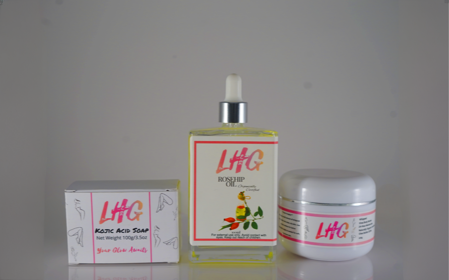 LHG skincare products including a bottle, box, and jar on a gray background